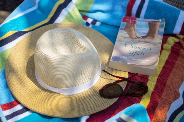 Sunscreen is not the only thing you should have at the beach; a Good Book is also a must!